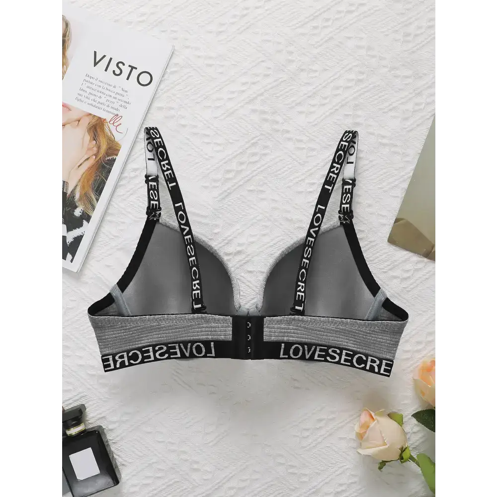 Striped adjustable push up bra in gray with black elastic straps and back closure
