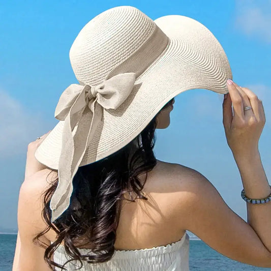 Stylish Summer Women Straw Hat Bowknot Wide Brim Floppy Panama Hats for outdoor beach fun by FAITOLAGI.