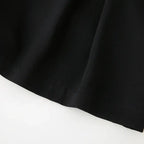 Close-up detail of black high waisted shorts fabric and hem stitching from The Lady's Haven Boutique