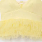 Yellow puffy sleeveless summer top with layered tulle design from The Lady's Haven Boutique