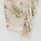 Close-up of floral pattern and ruffle details on sleeveless tie back floral dress from The Lady's Haven Boutique