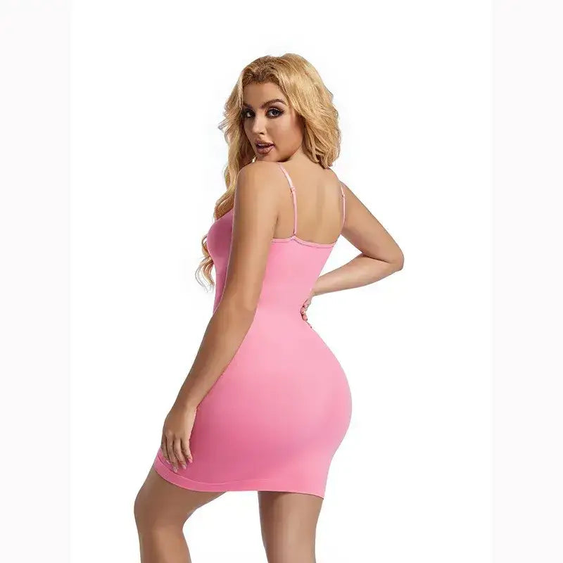 Woman wearing a pink tummy control body shaper for women by The Lady's Haven Boutique