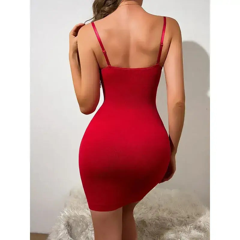 Back view of woman wearing a red tummy control body shaper for women with adjustable straps