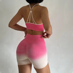 Stylish two piece athletic wear set for women featuring a pink sports bra and matching bike shorts
