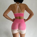 Two piece athletic wear set for women in pink and beige with a stylish back design and high-waisted shorts