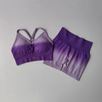 Purple two piece athletic wear set for women featuring a stylish sports bra and matching shorts