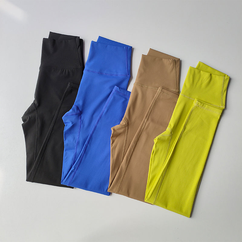 Variety of two piece workout clothing for women including black, blue, beige, and yellow leggings