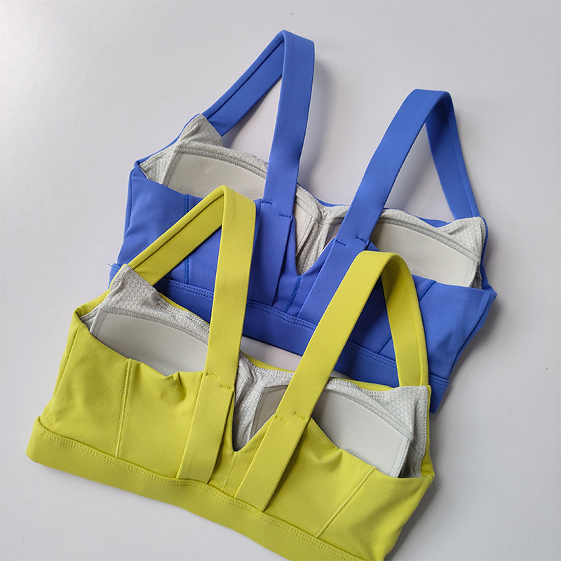 Two Piece Workout Clothing for Women featuring a Blue and Yellow Sports Bra with Adjustable Straps