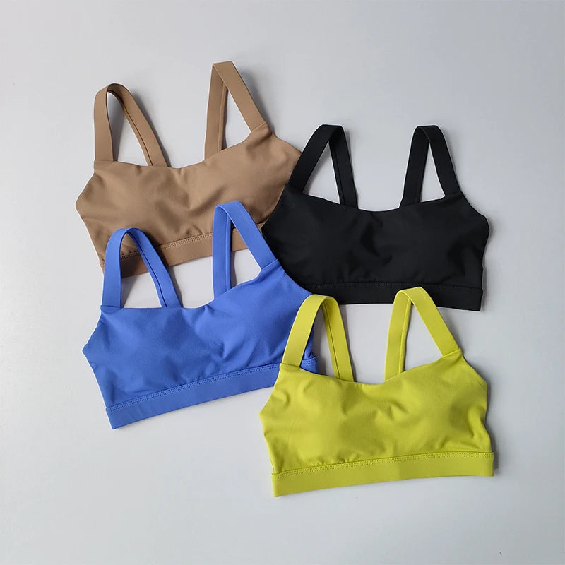 Colorful two piece workout clothing for women featuring four stylish sports bras in various shades