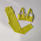 Bright yellow two piece workout clothing for women featuring a supportive sports bra and high-waisted leggings
