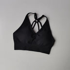 Black strappy sports bra, perfect for pairing with two piece workout outfits for stylish gym sessions