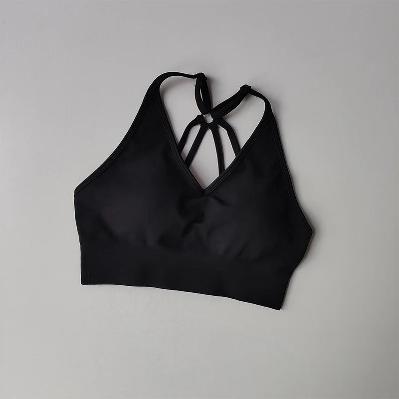 Black strappy sports bra, perfect for pairing with two piece workout outfits for stylish gym sessions