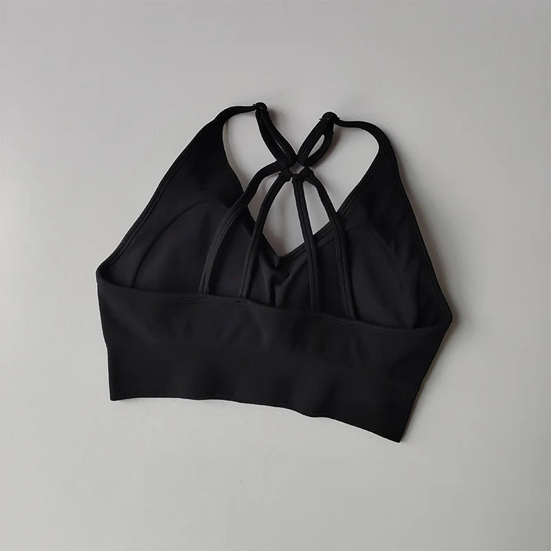 Black sports bra with crisscross straps from The Lady's Haven Boutique for two piece workout outfits