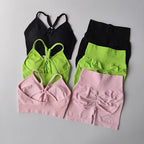 Two piece workout outfits in green, pink, and black with stylish designs for comfortable fitness wear