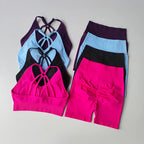 Colorful two piece workout outfits featuring stylish bras and comfortable shorts for active women