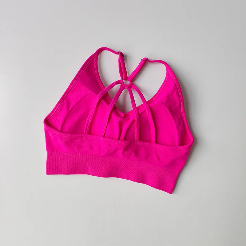 Hot pink sports bra featuring a stylish multi-strap design for two piece workout outfits
