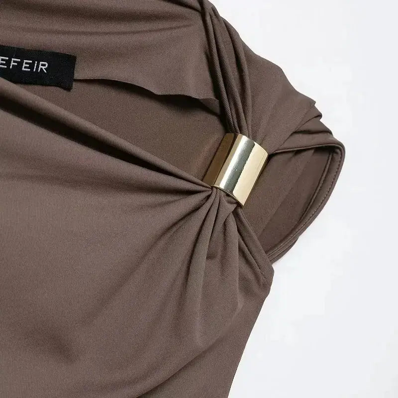 Close-up of a brown spring fashion tops for ladies with gold buckle detail from The Lady's Haven Boutique