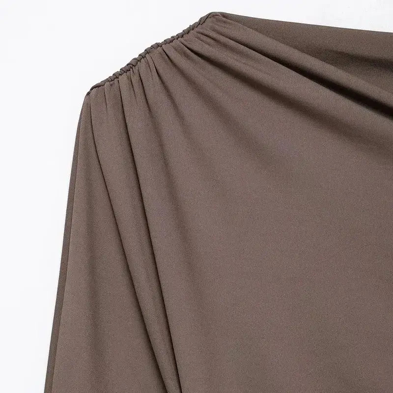 Close-up of brown elastic gathered detail on spring fashion tops for ladies from The Lady's Haven Boutique