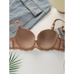 Beige textured bra from 2-piece underwear set by The Lady's Haven Boutique displayed with denim and decorative items