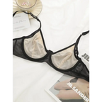 Black and beige breathable patchwork lingerie for women from The Lady's Haven Boutique laid on white fabric