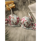 Close fitting floral bra and panty set featuring pink and green blooms on white fabric from The Lady's Haven Boutique