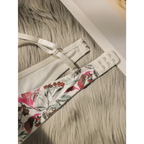 Close fitting floral bra and panty set with pink and green floral pattern on soft fabric