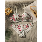 Close fitting floral bra and panty set in white with pink and green flower designs on soft fabric