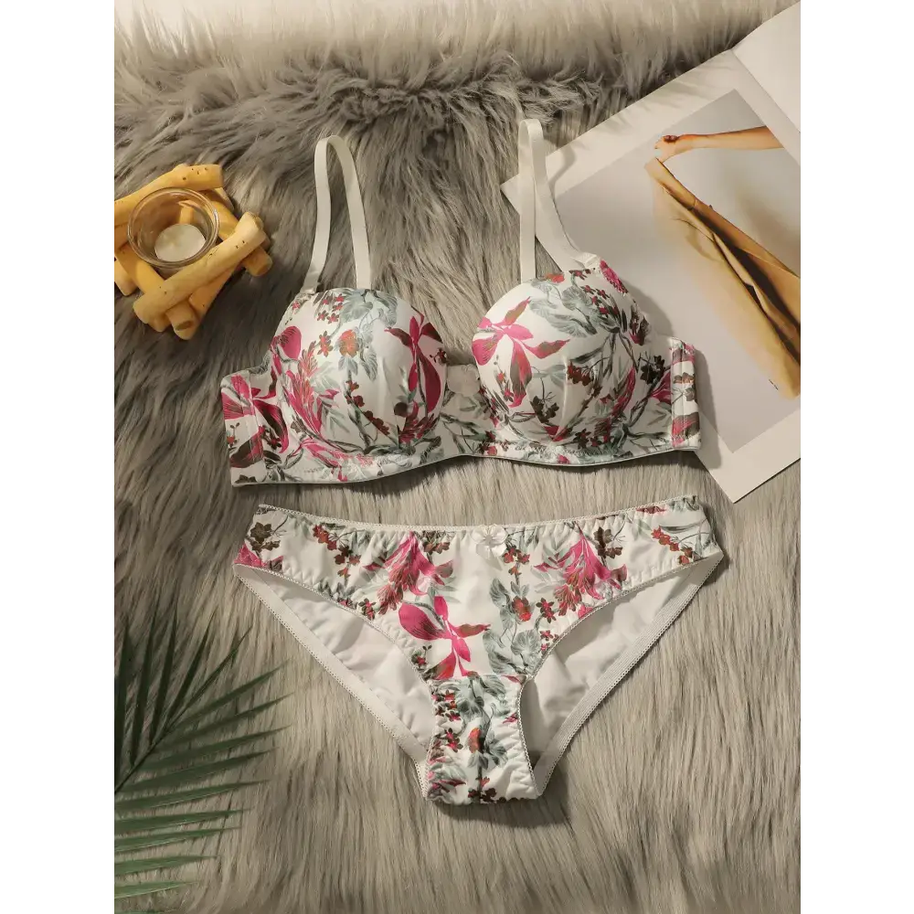 Close fitting floral bra and panty set in white with pink and green flower designs on soft fabric