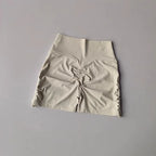 Light beige drawstring sports shorts for women with gathered sides for a flattering fit