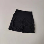 Black drawstring sports shorts for women featuring a comfortable and stylish design