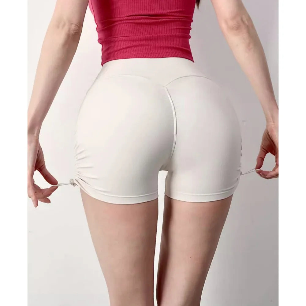 Comfortable white drawstring sports shorts for women with a flattering fit and adjustable design