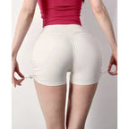 Comfortable white drawstring sports shorts for women with a flattering fit and adjustable design