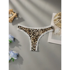 Leopard print lace underwear with white lace trim laid flat on a gray surface