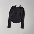 Black long sleeve yoga crop tops for women with adjustable straps and a stylish design