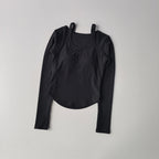 Black long sleeve yoga crop tops for women with a button-down neckline and fitted design
