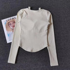 Cream long sleeve yoga crop tops for women with a stylish back design and comfortable fit