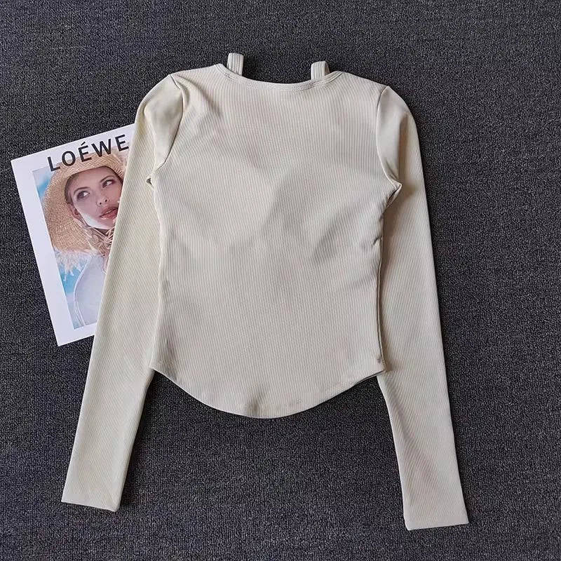 Cream long sleeve yoga crop tops for women with a stylish back design and comfortable fit