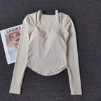 Cream Long Sleeve Yoga Crop Tops for Women with a Ribbed Texture and Button Detail