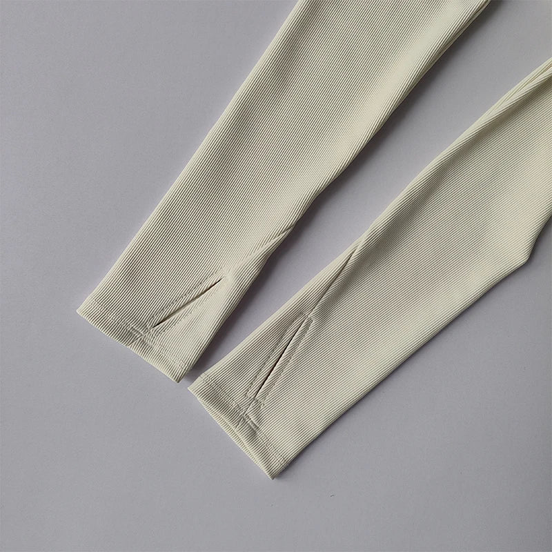 Beige long sleeve yoga crop tops for women with stylish slit detail on sleeves from The Lady's Haven Boutique