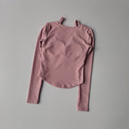 Pink long sleeve yoga crop tops for women with a textured finish for comfortable workouts