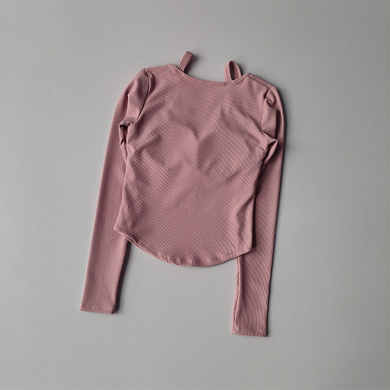 Pink long sleeve yoga crop tops for women with a textured finish for comfortable workouts