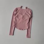 Soft pink long sleeve yoga crop tops for women with a stylish design and comfortable fit