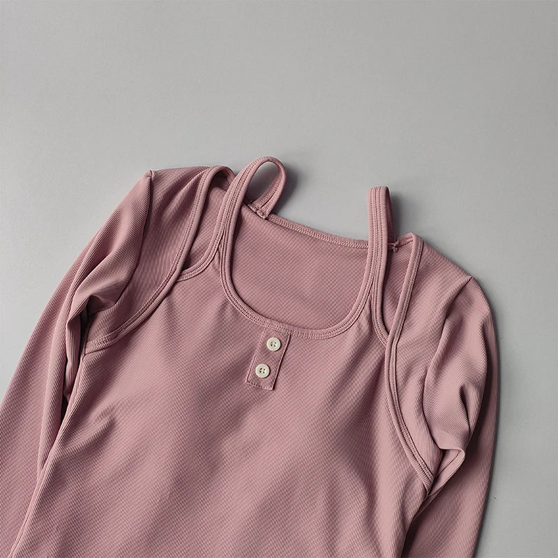 Light pink long sleeve yoga crop tops for women with button details for stylish workouts