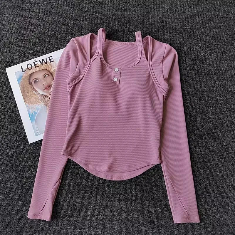 Light pink long sleeve yoga crop tops for women with button detail and soft ribbed fabric
