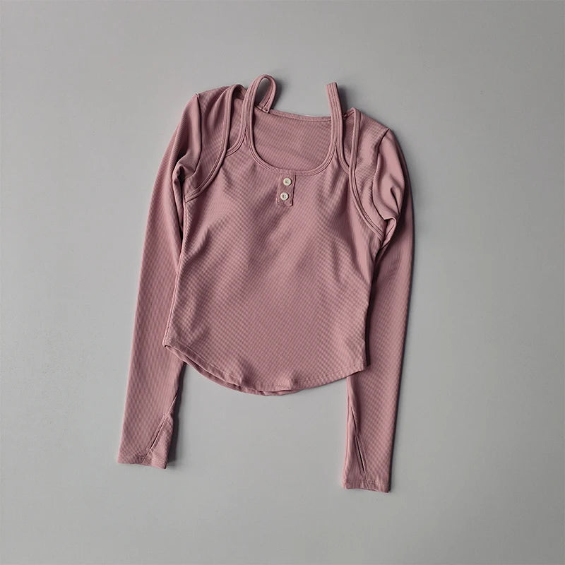 Pink long sleeve yoga crop tops for women featuring a textured fabric and button accents
