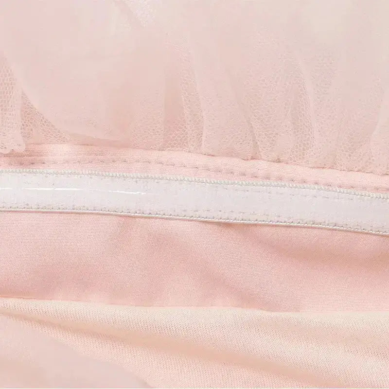 Close-up detail of fabric and stitching on pink casual cocktail dress from The Lady's Haven Boutique