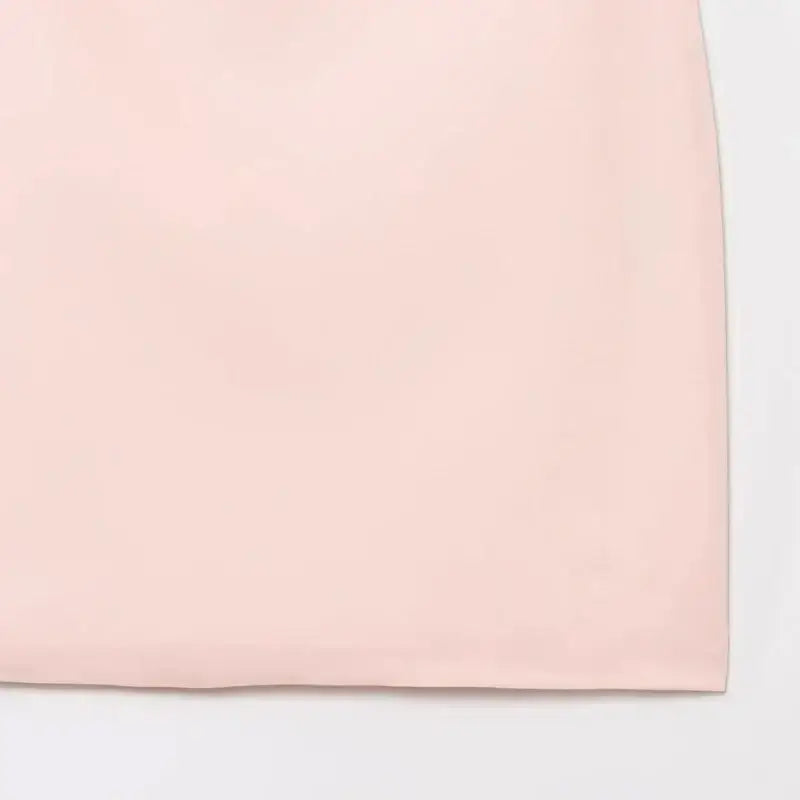 Close-up of the hem of a pink casual cocktail dress from The Lady's Haven Boutique