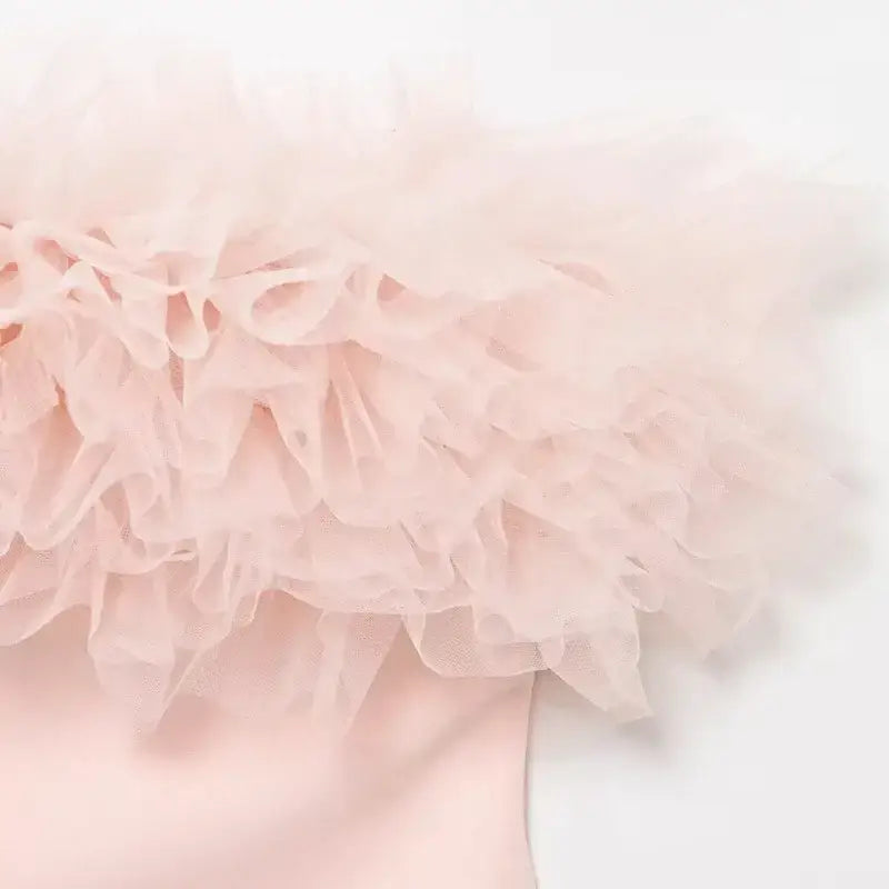 Close-up of pink casual cocktail dress with layered ruffle tulle detail from The Lady's Haven Boutique