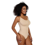 Beige ribbed thong bodysuit shapewear by The Lady's Haven Boutique modeled by smiling woman