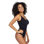 Smiling woman wearing black ribbed thong bodysuit shapewear from The Lady's Haven Boutique